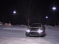 Black Civic doing E-brake slides in the snow.