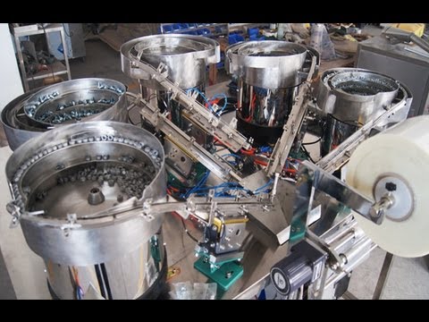 packaging machinery - On 23rd oct we GUANGZHOU LIANHE tried the run of the screw packaing machinery with five vibrating plates,which after about half hour testing of the screw pac...
