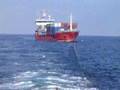 tugboat towing a boat 2
