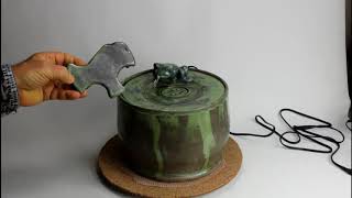 A ceramic cat water fountain with insert for Persian cats