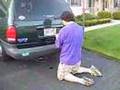 "ABN" removes a suggestive liscense plate frame from the van