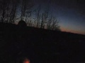 video 5 - 16 mar 2005. *frail common animal* ...rte 2 somewhere in ny. return trip from previous clip. dark sunset makes little light. parking lamps glow. oncoming car scares me away.