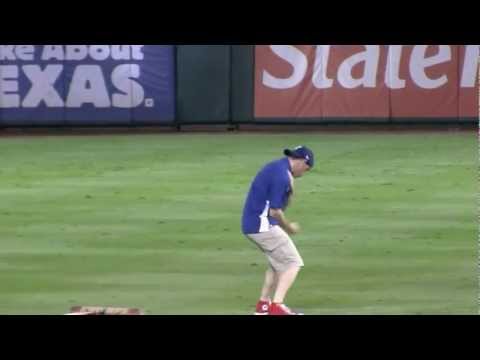 Dancing grounds crew member at 2011 World Series Game 4 Rangers Cardinals