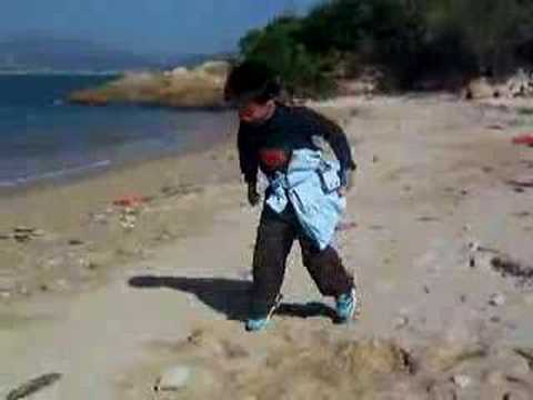 Harvey Li dancing on the beach at ...
