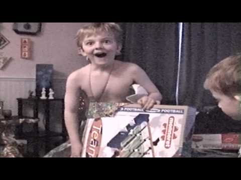 gift reaction funny - My brother Lee opening a christmas present - just a bit happy! *This was recorded in 2002, so the quality isn't great*