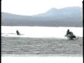 Kneeboarding over open water behind a Snowmobile
