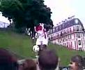 a guy playing wif the soccer ball in paris