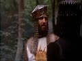 -Los Caballeros De La Mesa Cuadrada (Monty Phyton)-1.Escena del Caballero Negro. El Rey Arturo se enfrenta al Caballero Negro, que obstaculiza su paso.2. Escena de la Caza de Brujas. Toda una exhibición de Ciencia Medieval orientada a la identificación y caza de brujas herejes.
