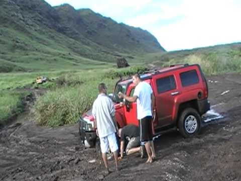 Hummer H3 backing up pond with broken front axle