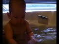 Baby Natalie splashing in her bath Baby Natalie splashing in her bath