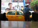You talkin' to me? Human behavior is fascinating. This man had an intense discussion with an empty taxicab, as witnessed from David's Bagel's in the East Village, NYC, August 2007