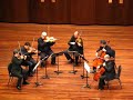 the chamber group, formed by sir neville mariner, performing in oxford at the ford center on the campus of ole miss.

the academy has an illustrious recording career, best exemplified by their performances on the film soundtracks for titanic, the english patient, and amadeus.  they have more recorded sessions (500+) than any other chamber group.

this clip contains the final few bars of the allegro moderato-allegro con brio movement from dvo?�k's sextet for strings in a major, op. 48.

unfortunately, the clapping spoils the delicate decrescendo that precedes the interlude between movements.

for the uninitiated (who obviously paid a great deal to see a chamber group of this caliber), the space between movements is a deliberate silence in the music.  except for some extraordinary circumstances the audience should refrain from ruining the effect with clapping.