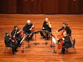 the chamber group, formed by sir neville mariner, performing in oxford at the ford center on the campus of ole miss.

the academy has an illustrious recording career, best exemplified by their performances on the film soundtracks for titanic, the english patient, and amadeus.  they have more recorded sessions (500+) than any other chamber group.

this clip contains the final few bars of the allegro moderato-allegro con brio movement from dvo?�k's sextet for strings in a major, op. 48.

unfortunately, the clapping spoils the delicate decrescendo that precedes the interlude between movements.

for the uninitiated (who obviously paid a great deal to see a chamber group of this caliber), the space between movements is a deliberate silence in the music.  except for some extraordinary circumstances the audience should refrain from ruining the effect with clapping.