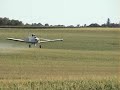 Crop Duster Spraying a Corn Feild