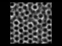 The effect of changing a scale parameter on pore size in the emergent dissipative pattern.