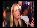 she's in front of the haunted mansion in disneyland in anaheim, talking about the haunted mansion. go figure.