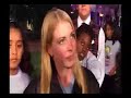 she's in front of the haunted mansion in disneyland in anaheim, talking about the haunted mansion. go figure.