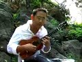 man playing the ukelele.