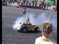 terry grant changing a wheel on his car whilest donutting! at santa pod ultimate street car 2007