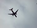 Plane flying away from Heathrow viewed from Bath Road