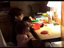 C and D play in their kitchen