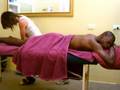 Athletics - muscular man gets sports massage