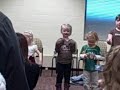 Aine singing at recital