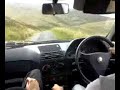 Alfa Romeo Driving up a Mountain.