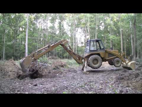 Case 580C Backhoe - Digging out three big stumps - Part 1 (HD)