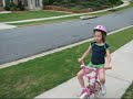 Madelyn riding her bike