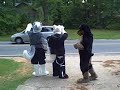 waving at cars in fursuit