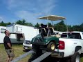 Justin loads the golf cart.