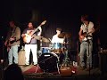 grayson performs with his band, the stumpknockers.
