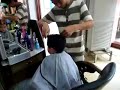 Chinese Hair stylist cutting boys Hair