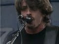 Foo Fighters playing at the Edgefest with a crowd who likes to throw shoes.
