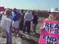 Anti-McCain/Palin signs and protesters at McCain Rally