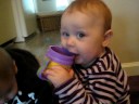 Chloe talks into a cup