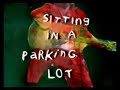 sitting in a parking lot