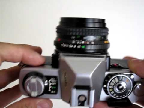 how to open a minolta xg 1 camera