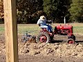 Farmall cub pulling a disk plow Farmall cub pulling a disk plow