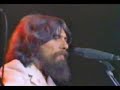 This is a great clip. Eric Clapton is playing electric guitar and can be seen to George's left a time of two during the song.