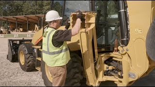Learn how to swap between the pavement and grouser backhoe stabilizer feet of your Cat 440 or 450 backhoe loader. 