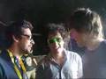 Colin Murray prepares The Wombats to go on stage.