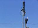 AIR2 Linemen removing old wood structure.