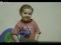 A 2years old boy plays juitar