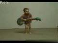 A 2years old boy plays juitar