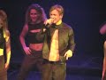 clip of adam rickitt performing i breathe again with his shirt off at the g-a-y club in 2000 for a crowd of gay men and lesbians. he is introduced by g-a-y club promoter jeremy joseph. this clip is provided for comment and editorial review of the show and only a part of the song is included in order to comply with fair use requirements as defined in copyright law.