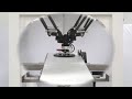 Adept Quattro robot handling steel balls on conveyor