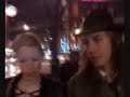 mike and kelly walking down rain street with the pogues