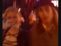 mike and kelly walking down rain street with the pogues